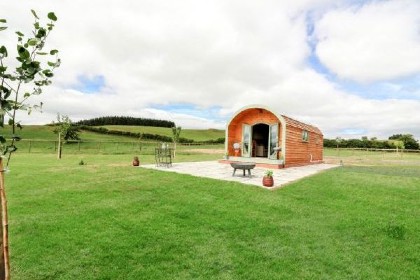 Log cabin with a country view